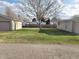 Spacious backyard with a large tree, providing ample shade at 609 S Grant St, Martinsville, IN 46151