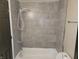 Remodeled bathroom with tiled shower at 609 S Grant St, Martinsville, IN 46151