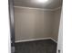 An empty bedroom featuring neutral paint, new carpet, and natural light from a window at 609 S Grant St, Martinsville, IN 46151