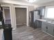 Modern kitchen with stainless steel appliances, granite countertops, and a breakfast bar, perfect for cooking and dining at 609 S Grant St, Martinsville, IN 46151