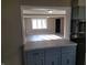 An open kitchen with modern countertops and views to the brightly lit living room at 609 S Grant St, Martinsville, IN 46151