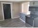 Well lit kitchen with stainless steel appliances, gray cabinets, and modern countertops at 609 S Grant St, Martinsville, IN 46151