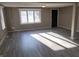 Neutral toned living room offers much sunlight and space at 609 S Grant St, Martinsville, IN 46151