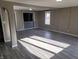 Bright and airy living room with hardwood floors and plenty of natural light, ideal for relaxation and entertainment at 609 S Grant St, Martinsville, IN 46151