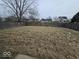 Large backyard with a wood fence and potential for landscaping at 6114 Arrowhead Dr, Anderson, IN 46013