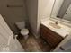 Half-bathroom with a single vanity, toilet, and tile flooring at 6114 Arrowhead Dr, Anderson, IN 46013