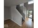 Welcoming entryway with staircase, natural light, and wood and carpet flooring at 6114 Arrowhead Dr, Anderson, IN 46013