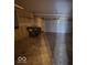 Spacious two-car garage with an automatic door and ample storage space at 6114 Arrowhead Dr, Anderson, IN 46013
