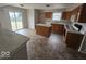 Eat-in kitchen features wood cabinets, an island, modern appliances, and sliding doors leading to the backyard at 6114 Arrowhead Dr, Anderson, IN 46013