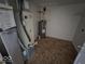 Utility room featuring tile floor, Bryant furnace, and water heater at 6114 Arrowhead Dr, Anderson, IN 46013