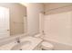 Bathroom with granite countertop, toilet, bathtub-shower, and large mirror at 6117 Arctic Cir, Indianapolis, IN 46237
