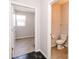 Bright half bathroom featuring neutral color palette and tile flooring at 6117 Arctic Cir, Indianapolis, IN 46237