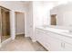 Bright bathroom featuring double vanity, tile floors, and glass shower at 6117 Arctic Cir, Indianapolis, IN 46237
