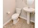 Half bathroom featuring a pedestal sink, toilet and tile flooring at 6117 Arctic Cir, Indianapolis, IN 46237