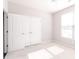 Sun-filled bedroom featuring plush carpeting and closet doors at 6117 Arctic Cir, Indianapolis, IN 46237