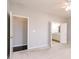 Bedroom featuring light grey walls, a ceiling fan, and access to a closet and a bathroom at 6117 Arctic Cir, Indianapolis, IN 46237