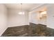 Bright dining area featuring modern lighting and stylish dark wood flooring at 6117 Arctic Cir, Indianapolis, IN 46237