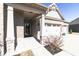 Home showcasing brick construction with a two car garage and a covered entryway at 6117 Arctic Cir, Indianapolis, IN 46237