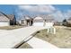 Charming single-story home with a large driveway and a two-car garage in a well-kept neighborhood at 6117 Arctic Cir, Indianapolis, IN 46237