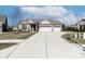 Charming single-story home with a large driveway and a two-car garage in a well-kept neighborhood at 6117 Arctic Cir, Indianapolis, IN 46237