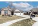 Beautiful brick home featuring a two car garage, a manicured lawn and mature landscaping at 6117 Arctic Cir, Indianapolis, IN 46237