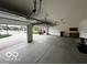 Spacious three-car garage with ample storage space and a view of the exterior at 6117 Arctic Cir, Indianapolis, IN 46237