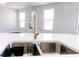 Close up of a kitchen island featuring a modern faucet and stainless steel sink at 6117 Arctic Cir, Indianapolis, IN 46237