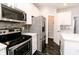 Kitchen featuring stainless steel appliances, lots of cabinets and a doorway to a pantry at 6117 Arctic Cir, Indianapolis, IN 46237