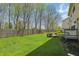 A large manicured lawn is surrounded by a wooden fence and mature trees at 6126 Golden Eagle Dr, Zionsville, IN 46077