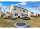 Spacious backyard with a patio, play equipment, and a trampoline, ideal for outdoor activities and entertainment at 6126 Golden Eagle Dr, Zionsville, IN 46077
