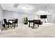 Basement features a large open space with a foosball table, arcade game, and additional seating, great for recreation at 6126 Golden Eagle Dr, Zionsville, IN 46077