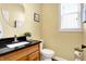 Bathroom featuring a vanity with black countertop and oval mirror at 6126 Golden Eagle Dr, Zionsville, IN 46077