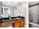 Bathroom featuring a vanity with dark countertops and a shower with a decorative curtain at 6126 Golden Eagle Dr, Zionsville, IN 46077