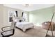 Bright bedroom with two windows, neutral walls, and a comfortable bed and carpet at 6126 Golden Eagle Dr, Zionsville, IN 46077