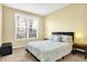 Bedroom featuring a bed with padded headboard, matching side tables, and a window at 6126 Golden Eagle Dr, Zionsville, IN 46077