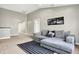 Comfortable bonus room featuring a cozy couch and a stylish striped rug at 6126 Golden Eagle Dr, Zionsville, IN 46077