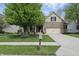 Inviting two-story home with brick and siding, a green lawn, and an attached garage, capturing suburban charm at 6126 Golden Eagle Dr, Zionsville, IN 46077