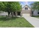 Attractive two-story house with a well-manicured lawn and a combination of brick and siding, plus an attached garage at 6126 Golden Eagle Dr, Zionsville, IN 46077