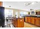 Open concept kitchen features granite countertops, an island, and stainless steel appliances at 6126 Golden Eagle Dr, Zionsville, IN 46077