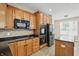 Bright kitchen features stainless steel appliances, wooden cabinets, and a kitchen island at 6126 Golden Eagle Dr, Zionsville, IN 46077