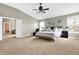 Bright main bedroom with a ceiling fan, large windows, and neutral decor at 6126 Golden Eagle Dr, Zionsville, IN 46077