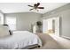 Serene main bedroom with contemporary ceiling fan and view to the Primary bath at 6126 Golden Eagle Dr, Zionsville, IN 46077