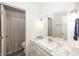 Bright bathroom with modern sink and vanity, with a view of shower and toilet at 615 Conner Creek Dr, Fishers, IN 46038