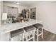 Kitchen showcases a marble countertop island with seating, and stainless steel appliances at 615 Conner Creek Dr, Fishers, IN 46038
