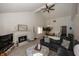 Bright living room with high ceilings features a cozy fireplace, and comfortable seating at 615 Conner Creek Dr, Fishers, IN 46038