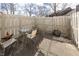 Cozy patio with weathered fence and outdoor seating at 615 Conner Creek Dr, Fishers, IN 46038