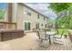 Spacious wooden deck with outdoor seating and a hot tub, perfect for entertaining at 6530 Grant Wood Ct, Indianapolis, IN 46256
