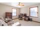 Bedroom featuring a work desk, ceiling fan, and bookshelf with a comfortable sitting chair at 6530 Grant Wood Ct, Indianapolis, IN 46256