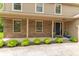 Welcoming front entrance featuring a brick facade, well-maintained landscaping, and a stylish front door at 6530 Grant Wood Ct, Indianapolis, IN 46256
