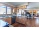 Kitchen with maple cabinets, granite counters, stainless appliances, hardwood flooring and breakfast bar at 6530 Grant Wood Ct, Indianapolis, IN 46256